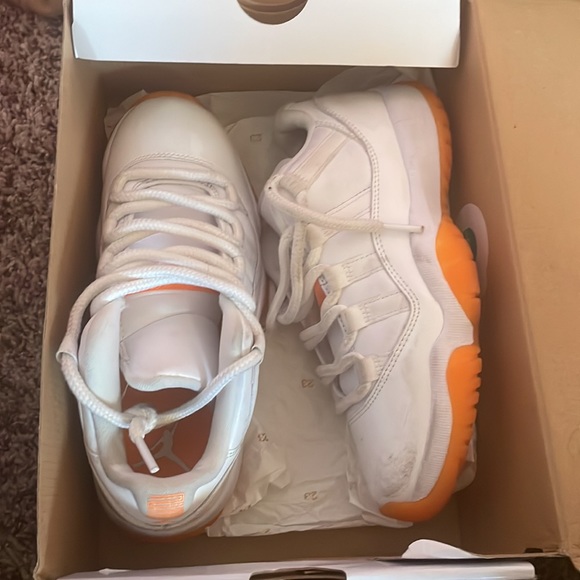 These are Jordan 11s low top. Orange and white. They need a good washing. - Picture 2 of 6